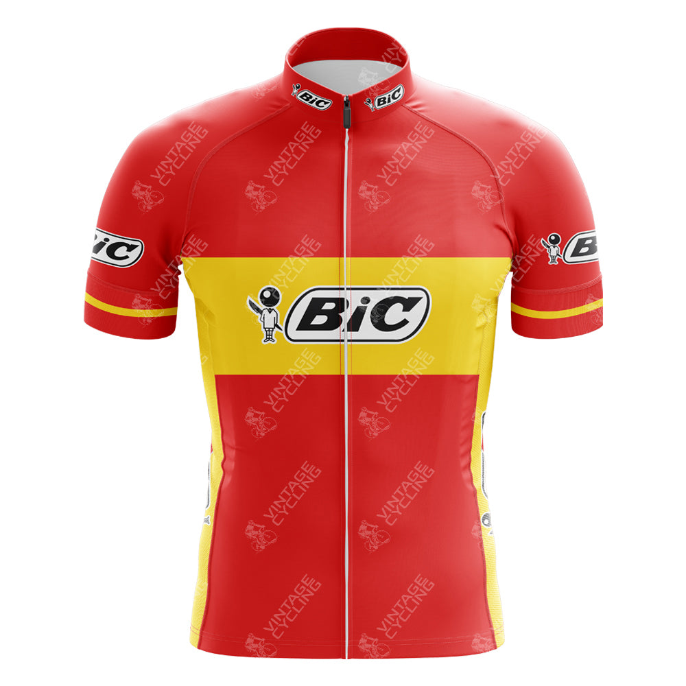 The BIC Spain Short Sleeve Retro Cycling Jersey features a red and yellow design with horizontal stripes, inspired by a Tour de France winner. Made from lightweight polyester, it includes a full front zipper and displays the BIC logo on the chest, sleeves, and collar.
