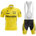 The Del Tongo-MG Maglificio Retro Short Sleeve Cycling Set features a yellow jersey with sponsor logos, black details, and matching bib shorts in black and yellow with white straps, inspired by classic race designs.