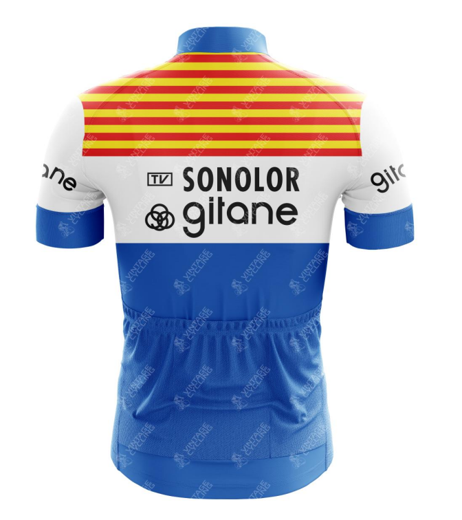 The Sonolor Gitane Retro Cycling Jerseys back has a vintage style with red and yellow horizontal shoulder stripes. A white section displays Sonolor Gitane text and logos, while the blue bottom half and short sleeves feature small Gitane logos. Its made from lightweight polyester.