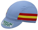 The Tricofilina Coppi Retro Cycling Cap is light blue with red and yellow side stripes. The brim displays TRICOFILINA COPPI in green and black, capturing vintage Tour de France style.
