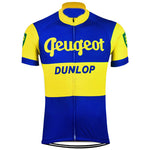The Peugeot BP Dunlop Retro Cycling Jersey features a vintage 1961 design with blue and yellow colors, short sleeves, a front zipper, and Peugeot in white across the chest above the Dunlop logo.