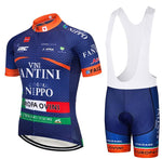 Performance cycling set featuring the Nippo Vini Fantini Team Jersey in blue with sponsor logos, red, green, and white accents. Includes matching bib shorts with white straps and branding.