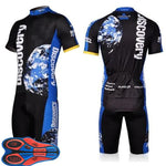 The Discovery Channel Cycling Jersey Set features a black, blue, and white design with Earth graphics and Discovery text. This breathable set includes short sleeves and vibrant orange and blue padded shorts, ideal for cycling enthusiasts.