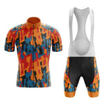 The Jazzy Orange Retro Cycling Jersey Set features a breathable fabric with an abstract design in orange, blue, and black. The jersey has a solid orange collar, while the bib shorts include matching side patterns, black central panels, and orange leg cuffs for optimal performance.