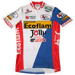 The Ecoflam-Jolly-Alfa Lum Retro Cycling Jersey showcases a retro design with blue, red, and white panels. It prominently features logos, including Ecoflam-Jolly-Alfa Lum and other sponsors. Red accents on the sleeves and collar add vibrant style.