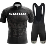 The SRAM Retro Cycling Jersey Set includes a black and gray geometric-patterned jersey made from breathable performance fabric, accompanied by black bib shorts.