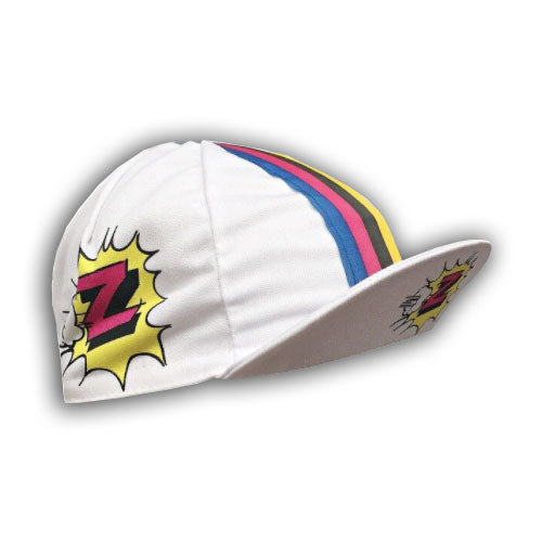 The Vetements Team Z Retro Cycling Cap sports a classic design with white fabric, colorful blue, pink, and yellow stripes, and comic-style yellow explosions on each side featuring a red and black Z, encapsulating the iconic Team Z vibe.