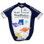 The WordPerfect-Colnago–Decca Retro Cycling Jersey features a white center, dark blue sides with floppy disk designs, and logos from iconic brands like Suntour and Colnago. Made from lightweight polyester, it brings a nostalgic touch to your cycling gear.