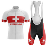 The Swiss Small Flag Cycling Jersey Set comprises a white and red jersey with Switzerland and a Swiss cross, styled as the Swiss flag, along with matching red and black bib shorts featuring Swiss cross designs.