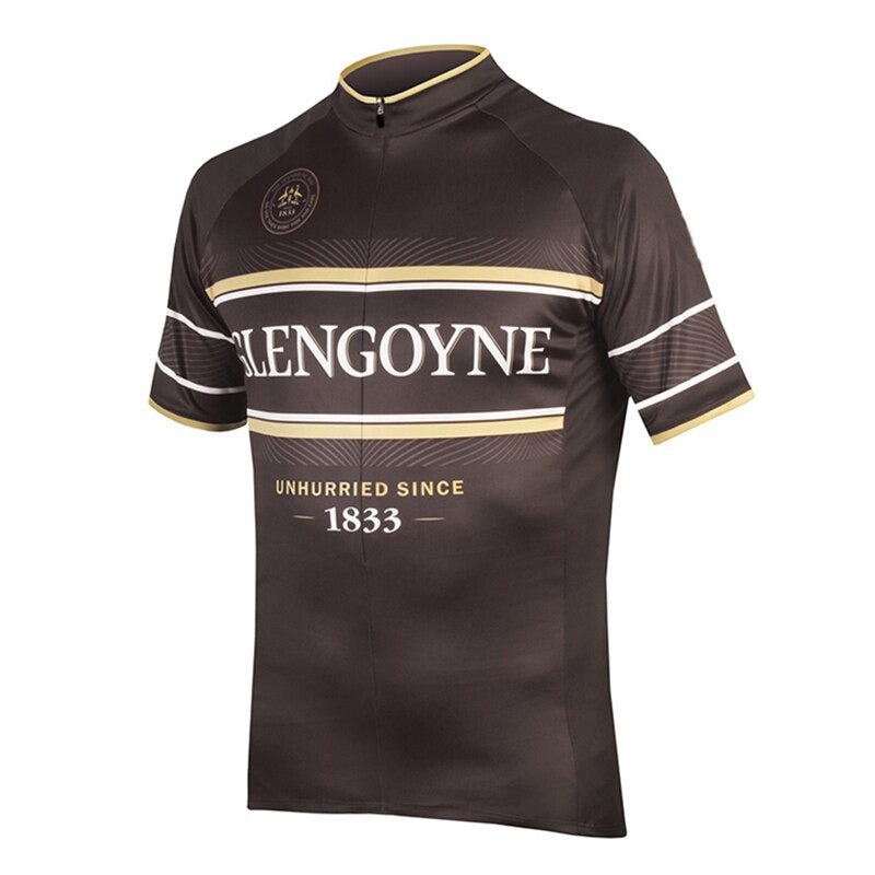 The Glengoyne Whisky Retro Cycling Jersey features a brown base with golden and white accents, merging performance with vintage style. It displays GLENGOYNE and UNHURRIED SINCE 1833, referencing Glengoyne Whiskys heritage. It includes short sleeves and a collar zip.