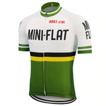 The Mini Flat Retro Cycling Jersey showcases a MINI-FLAT text with a bold yellow stripe and color blocks in green, white, and black. Made from lightweight polyester for performance cycling, it features BOULE DOR on the top and green stripes on the short sleeves.