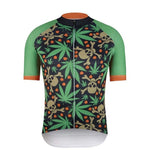 The Green Leaf Cycling Jersey features a vivid pattern of green leaves, brown skulls, and small red dots. Made from lightweight polyester, it offers light green sleeves with orange trim that match the black front zipper seamlessly.