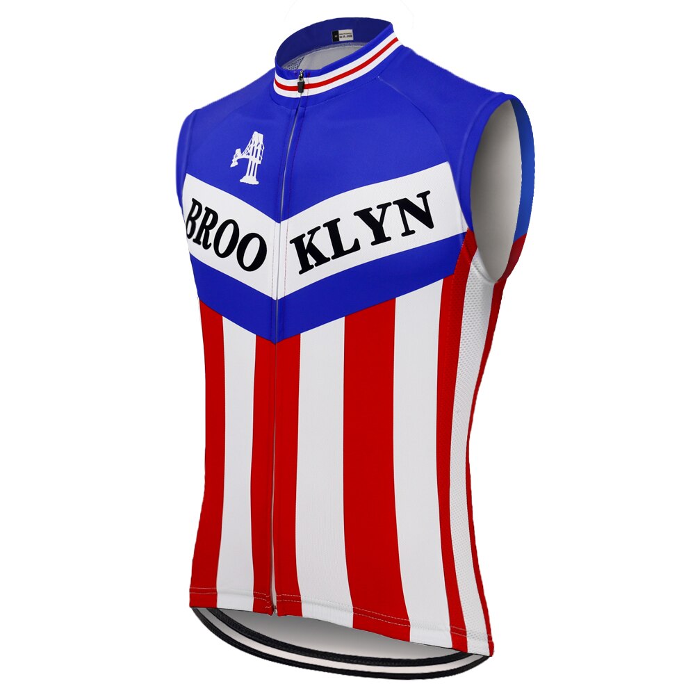 The Brooklyn Chewing Gum Retro Cycling Vest Blue is a sleeveless jersey with a blue top, red and white vertical stripes at the bottom, and BROOKLYN in bold black letters on a white band across the chest, evoking retro styles worn by Roger de Vlaeminck.