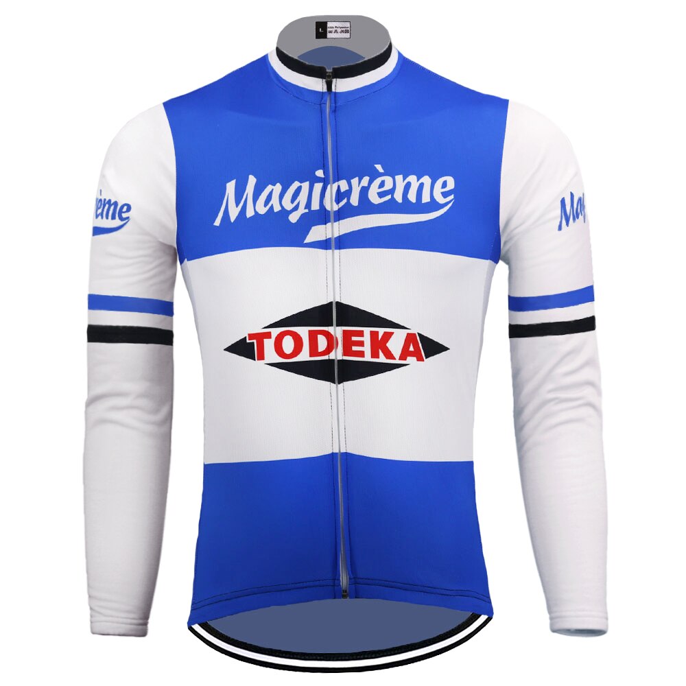 The Todeka Magicreme Retro Cycling Jersey features Magicrème on blue and white with a central black diamond displaying Todeka in red. It has a full front zipper, striped sleeves, and offers long-sleeve nostalgia with performance.