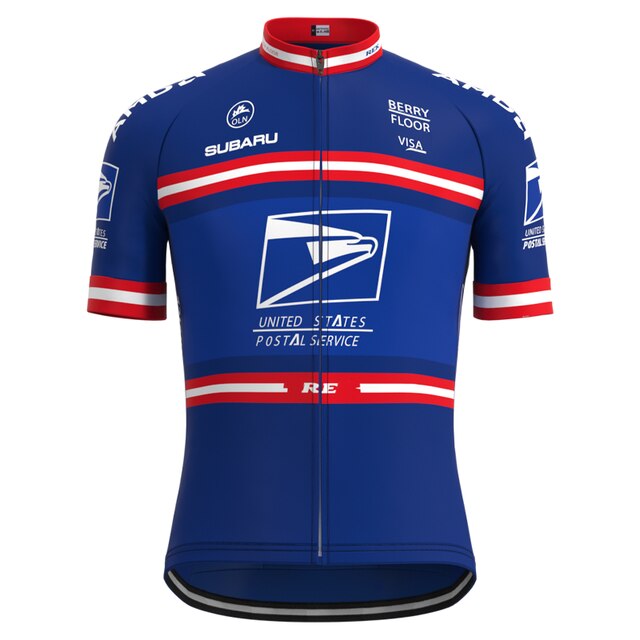 The US Postal Service Short Sleeve Pro Cycling Team Jersey Set features the prominent USPS logo, red and white chest and sleeve stripes, and logos for Subaru, Berry Floor, and Visa. It was once worn by Lance Armstrong.
