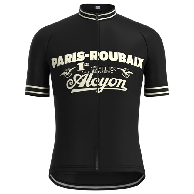 The Paris-Roubaix Retro Cycling Jersey Set features a black jersey with bold white Paris-Roubaix text on the front, adorned with decorative text and vintage graphics. White stripes on sleeves and collar add timeless elegance to this performance cycling wear.