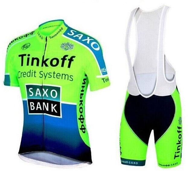 The Tinkoff Saxo Bank Green Bib Set includes a vibrant green and blue short-sleeve cycling jersey crafted from lightweight polyester, displaying logos for Tinkoff Credit Systems and Saxo Bank. The breathable bib shorts feature black accents and white shoulder straps for added comfort.