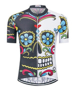 The Coloured Skull Cycling Jersey features a vibrant sugar skull design with bold flowers, swirls, and a blend of black and white backgrounds accented in red, yellow, and blue. Made from lightweight polyester with a zippered front for practicality.