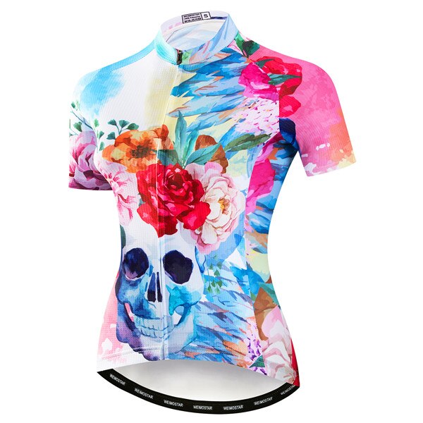 The Womens Skull & Roses Cycling Jersey is a vibrant short-sleeved polyester piece adorned with colorful floral designs and a prominent skull motif. Its striking artistic pattern mixes pink, blue, and white hues.