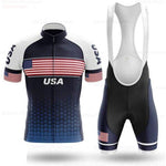 The USA Flag Cycling Team Jersey Set proudly showcases the USA flag motif with a blue jersey featuring white shoulders, an American flag on the chest, and USA text. The black bib shorts perfectly complement the ensemble with a flag accent on one leg.