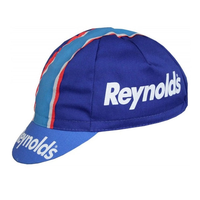 Vintage cycling lovers will adore the Reynolds Retro Cycling Cap, featuring a blue base with iconic white Reynolds text on the side and brim. Its central red and white striped panel adds classic charm, making it a timeless accessory.
