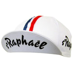The St Raphael Retro Cycling Cap is white with a red, white, and blue stripe on top. St Raphaël is boldly displayed in black on the brim, with the same vintage text partially visible on the side.