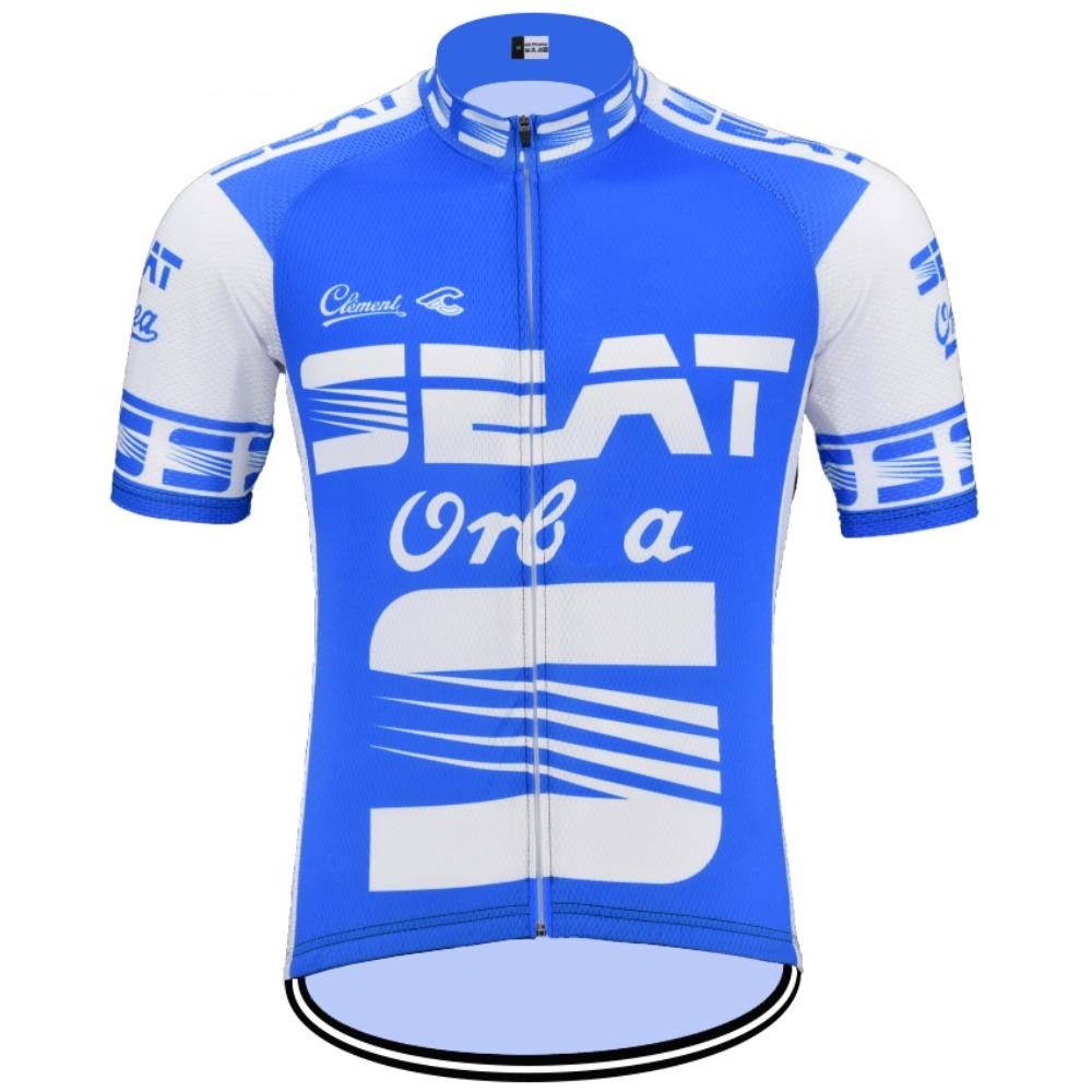 The SEAT Orbea Retro Cycling Jersey is blue and white with short sleeves, featuring the SEAT logo prominently in white. It has contrasting patterns on the sleeves and sides, celebrating renowned Orbea bicycles.