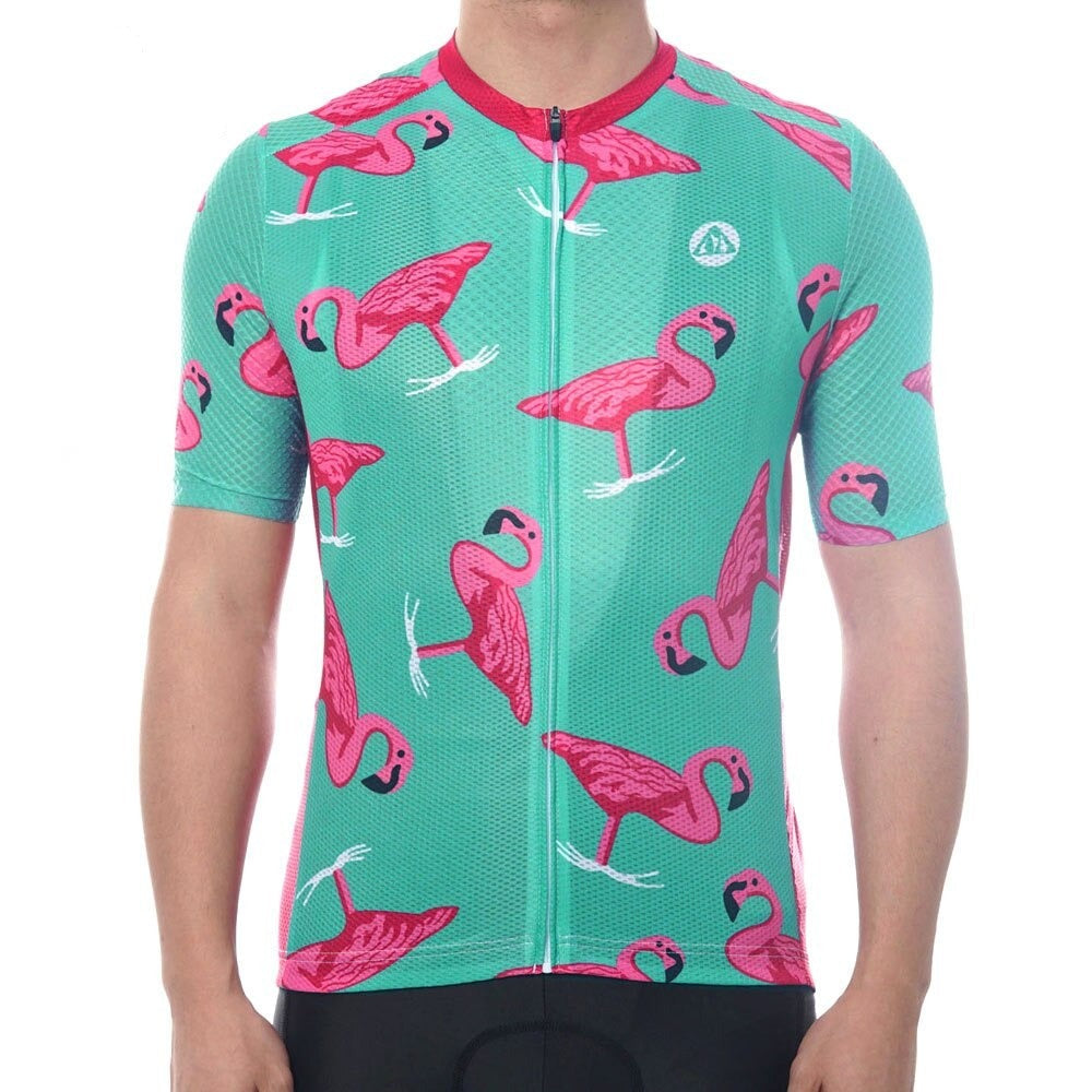 A person wearing the Flamingo Cycling Jersey stands against a teal background with pink flamingos. Made from lightweight polyester, this performance jersey includes a front zipper and short sleeves, with only the torso visible.