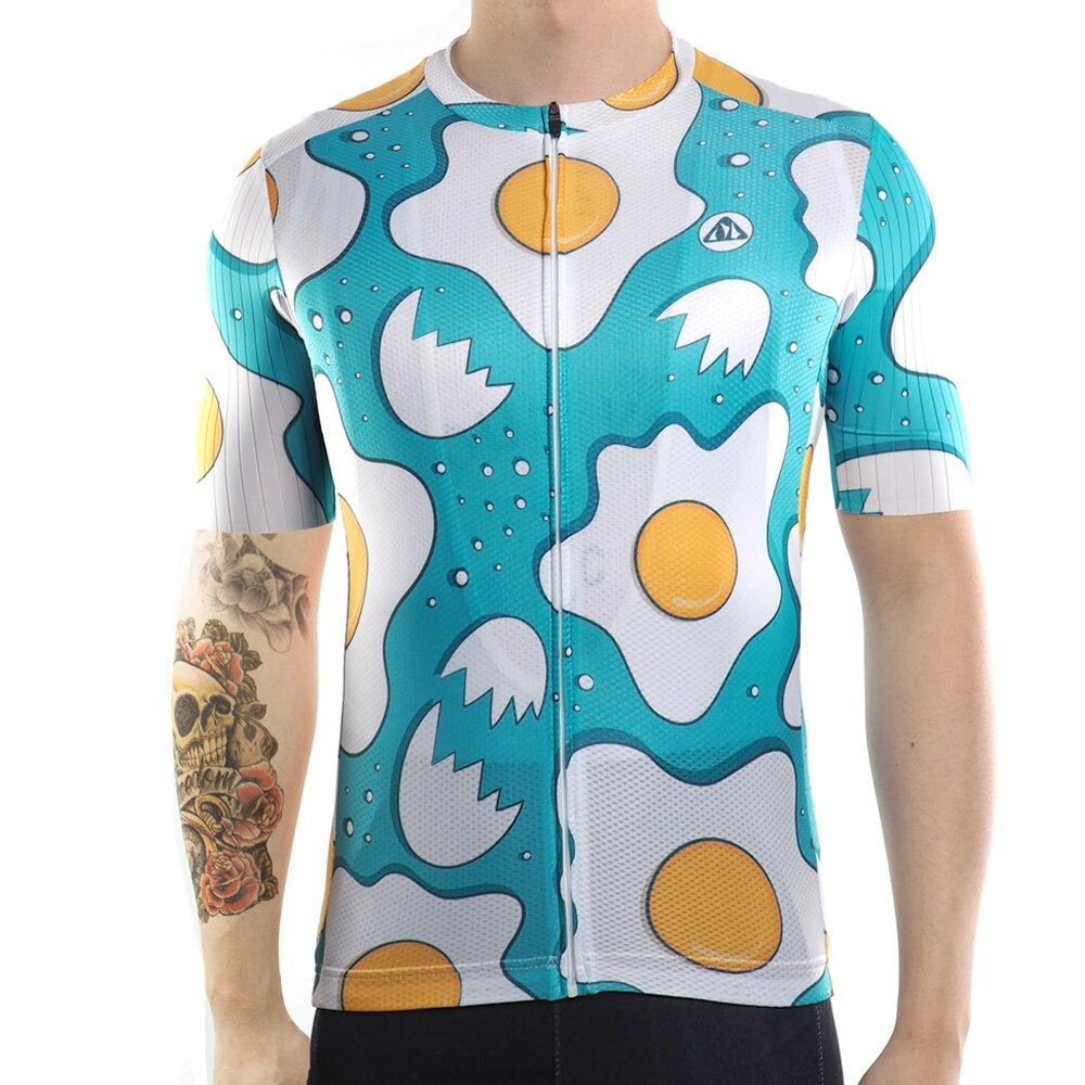 A person displays the Fried Eggs Cycling Jersey, crafted from lightweight polyester for top aerodynamic performance, against a white backdrop. Their right arm features a detailed skull and flower tattoo.