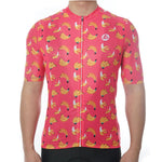A person wears the Bananas Cycling Jersey, a banana-themed bright pink design crafted from lightweight polyester for enhanced performance. The short sleeves and front zipper complete this vibrant look against a plain white background.