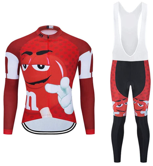 The M&Ms Cycling Jersey Long Set is a red and white outfit featuring a cartoon character, with a performance-designed long-sleeve jersey and zip-up front. The pants have shoulder straps and black padding for added comfort, with an optional fleece lining.