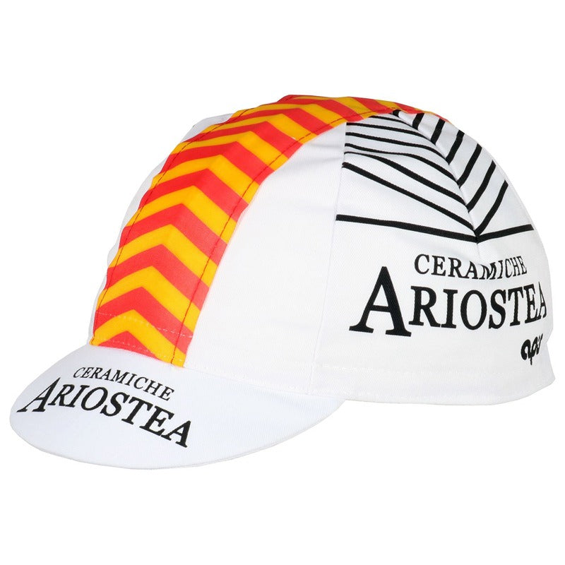 The Ceramiche Ariostea Retro Cycling Cap features a white base with Ceramiche Ariostea in black, red and yellow chevron stripes on the side, a top black stripe pattern, and a small brim also showcasing the text.