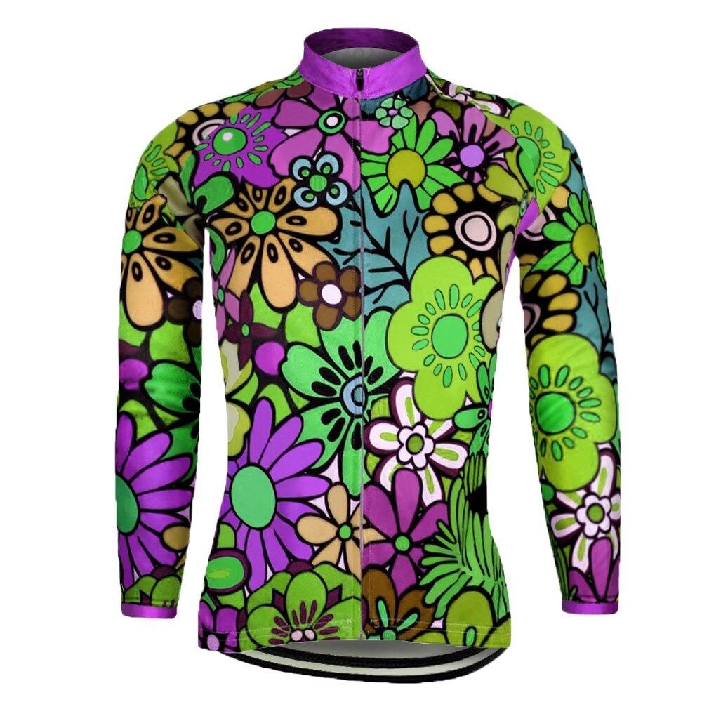 The Womens Long Sleeve Floral Design Cycling Jersey showcases a lively floral print with purple, green, yellow, and pink flowers on a multicolored background. It includes a front zipper, a purple collar, and an optional fleece lining for extra warmth on cooler rides.