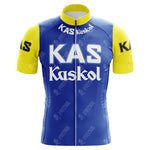 The KAS Kaskol Retro Cycling Jersey in blue features vibrant yellow sleeves and collar, crafted from lightweight polyester. KAS Kaskol is boldly printed on the front, with a distinctive K on each sleeve, making it standout performance cycling apparel.