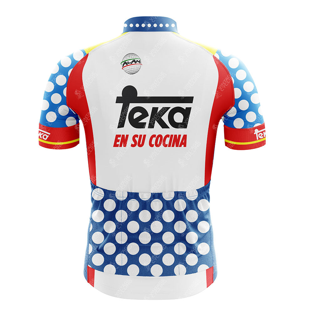 The Mars White Retro Cycling Jersey features blue and white polka dots, red side panels, yellow accents, and a large Teka logo with "EN SU COCINA" on the back—classic, breathable style with vintage flair.