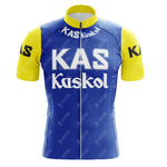 The KAS V2 Retro Short Sleeve Cycling Set features a blue jersey with KAS Kaskol in white across the chest. Yellow sleeves display KAS in black. It includes a high collar and front zipper. Check the sizing guide for the perfect fit.