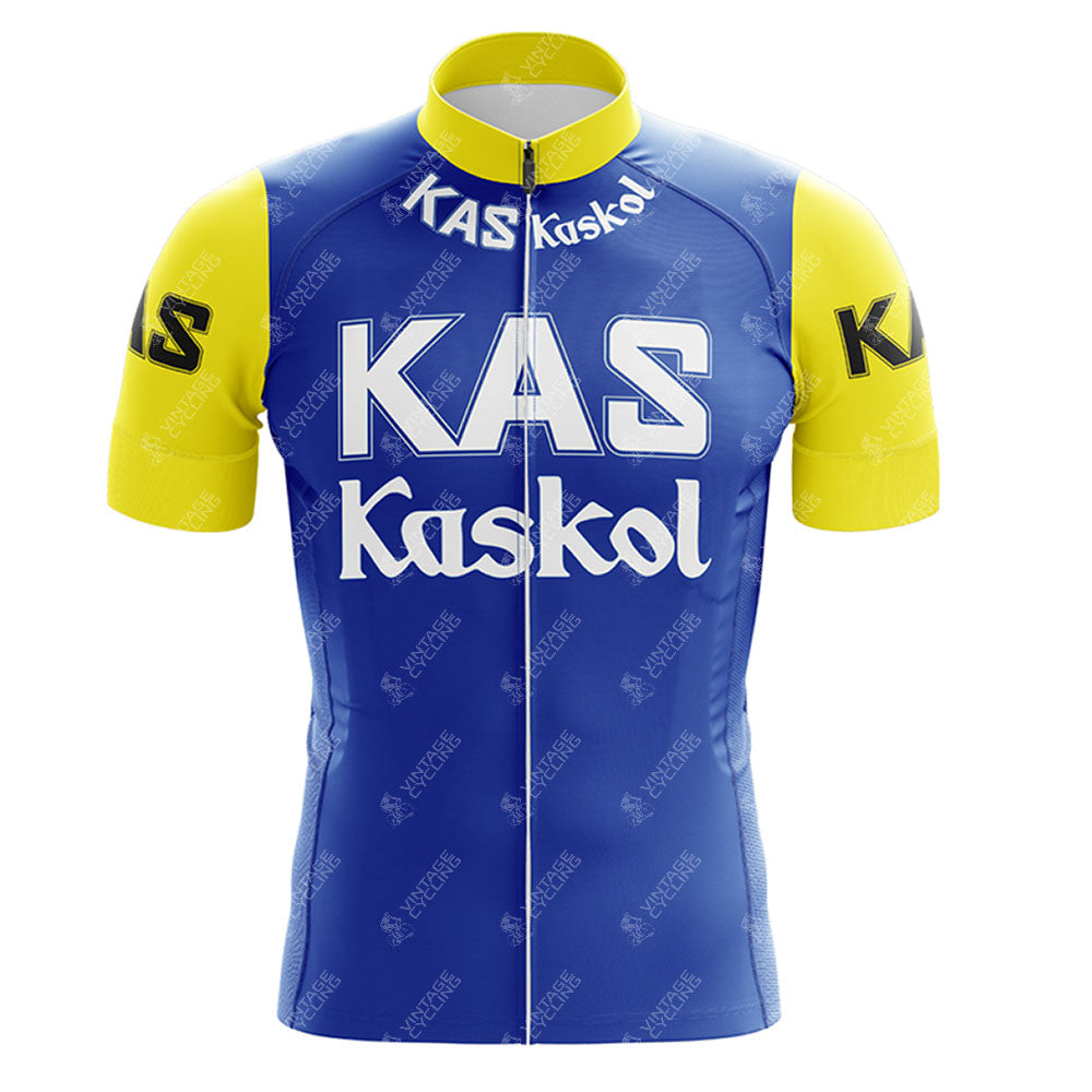 The KAS V2 Retro Short Sleeve Cycling Set features a blue jersey with KAS Kaskol in white across the chest. Yellow sleeves display KAS in black. It includes a high collar and front zipper. Check the sizing guide for the perfect fit.
