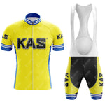 The KAS Yellow Retro Short Sleeve Cycling Set includes a yellow jersey with blue and white trim featuring KAS text, and matching bib shorts in yellow, blue, and white, also with KAS text.