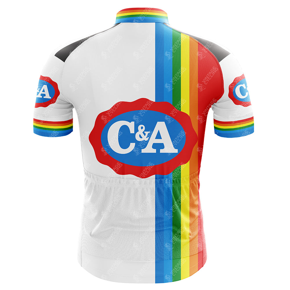 The C&A Retro Short Sleeve Cycling Set features a back view jersey with vertical blue, red, yellow, and green stripes on white, accented by rainbow-striped cuffs. Check our size guide for the perfect jersey and shorts fit.