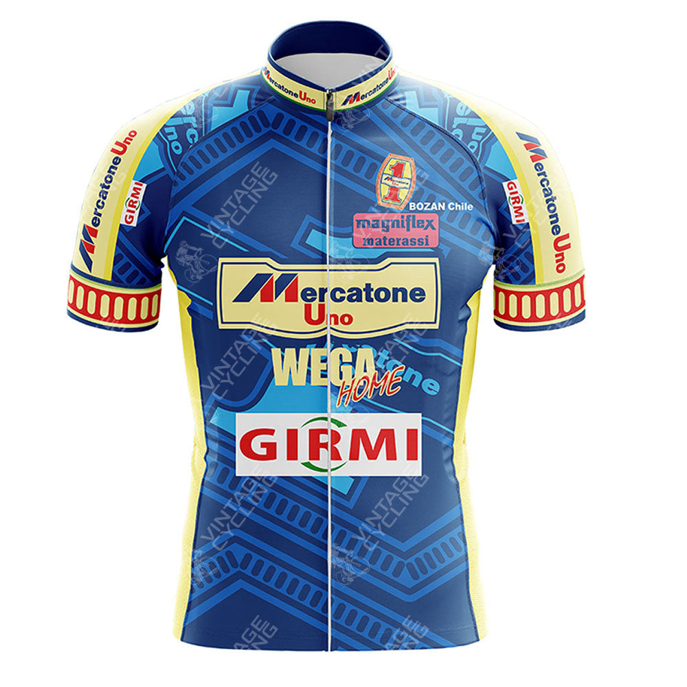 The Todeka Magicreme Retro Short Sleeve Cycling Set features a blue and yellow jersey with sponsor logos on the front and sleeves, including Mercatone Uno, WEGA, Home, Girmi, and Magniflex Materassi.