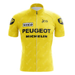 The PEUGEOT Yellow Retro Short Sleeve Cycling Set boasts a vintage look with bold black PEUGEOT and MICHELIN logos on the classic yellow jersey. The sleeves feature a distinct black circle with a yellow BP. A front zipper completes the timeless style.