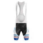 The G.B.C. - LIBERTAS Retro Short Sleeve Cycling Set includes a stylish cycling bib with a white upper and black shorts. The leg bands feature blue and red stripes with text, adorned with Vintage Cyclage and Peugeot, perfectly complementing your Ford White Blue jersey.