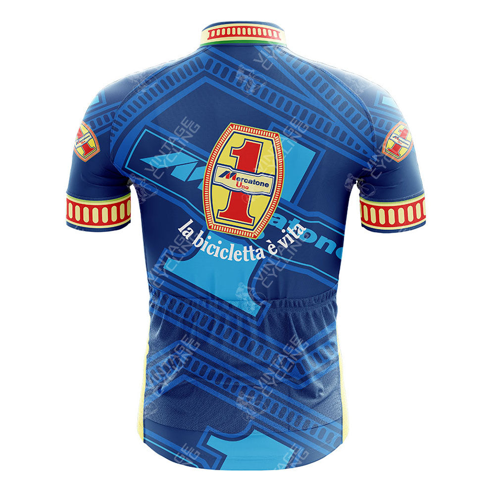 Back view of the blue Todeka Magicreme Retro Short Sleeve Cycling Set jersey, featuring a large yellow and red shield with 1, cicli, la bicicletta è vita in white, Mercatone Uno accents, plus geometric patterns and logos.