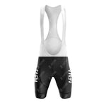 The FAEMA Yellow Retro Short Sleeve Cycling Set includes black bib shorts with white suspenders, featuring a subtle abstract pattern and AEM in white on each leg, perfect for cycling enthusiasts who enjoy a classic style.