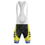 The KAS Yellow Retro Short Sleeve Cycling Set includes retro cycling bib shorts with white straps, showcasing vibrant yellow and black sections and blue horizontal stripes at the bottom. KAS is printed vertically on the thighs, making it an essential piece of the set.