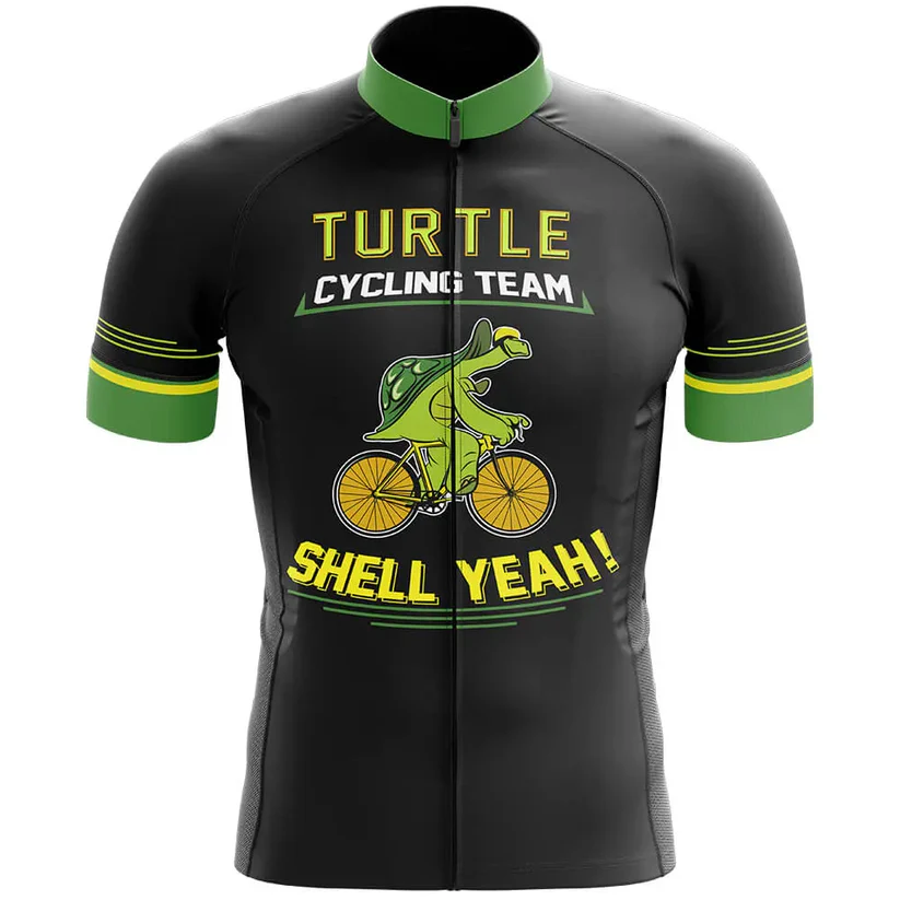 The Wales Men Short Sleeve Cycling Set features a black jersey with green accents, showcasing a cartoon turtle on a yellow bike. "Turtle Cycling Team" and "Shell Yeah!" appear in bold yellow and white letters—perfect for cycling enthusiasts.