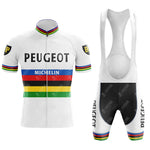 The PEUGEOT color Retro Short Sleeve Cycling Set includes a white jersey and bib shorts with rainbow stripes and vintage cycling design. PEUGEOT and MICHELIN appear along with a P logo on the sleeves, while the shorts feature PEUGEOT and rainbow cuffs.