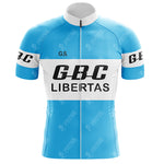 The Gios Torino Retro Short Sleeve Cycling Set includes a light blue and white jersey for enthusiasts, featuring GBC LIBERTAS in bold black on the chest and G.S. on the upper left. Black GBC decorates the white banded sleeves, completing its classic look.