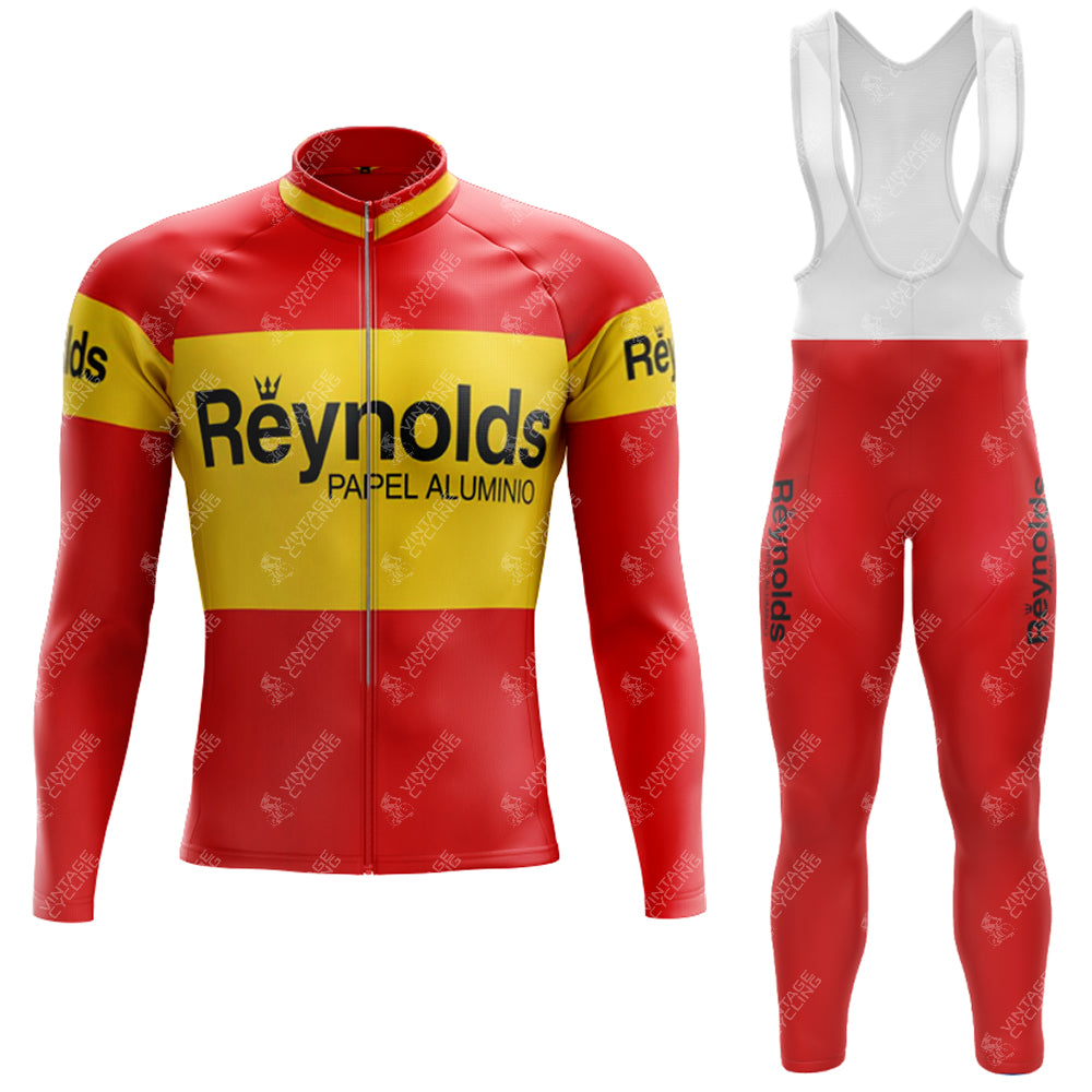 The 1980s Red Reynolds Retro Long Sleeve Cycling Set includes a Reynolds Papel Aluminio jersey with yellow arm bands and a zipper front, plus bib tights with leg text. An optional gel seat pad enhances comfort.