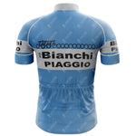 The 1983 Bianchi Retro Short Sleeve Cycling Set includes a blue jersey with Bianchi Piaggio in black on white shoulder and lower back panels. A bicycle design adorns the upper back, and it has convenient rear pockets.